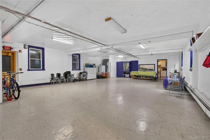 Open basement room with tile floor